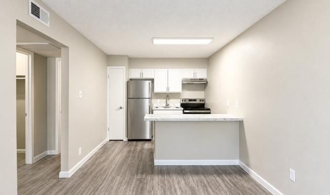 a kitchen with white cabinets