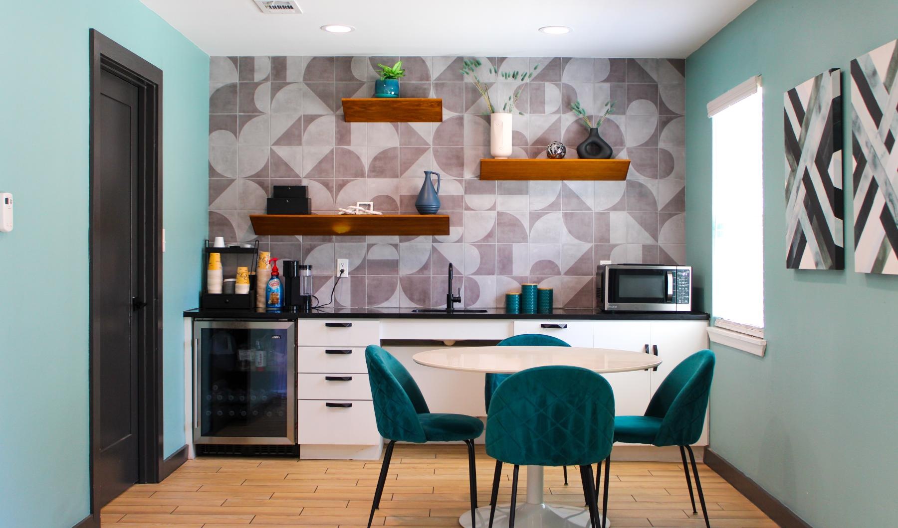a kitchen with a table and chairs